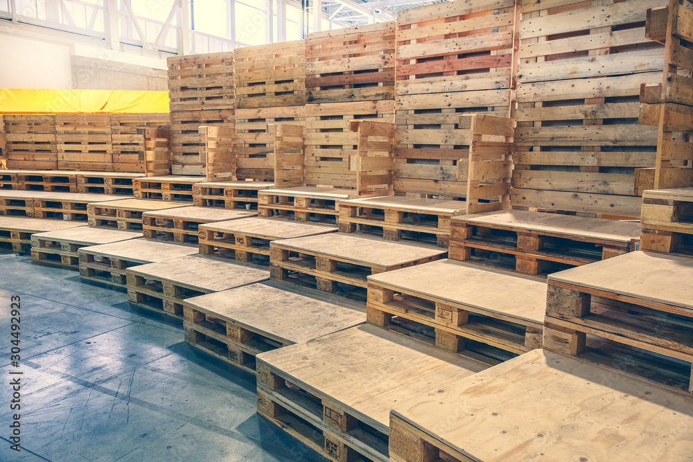 many empty pallets stored in warehouse many empty pallets stored in warehouse