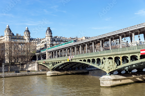 Paris, France: Metro traffic on Pont Bir-Hakeim (Passy viaduc) with view over Passy station buildings - Paris, France © UlyssePixel