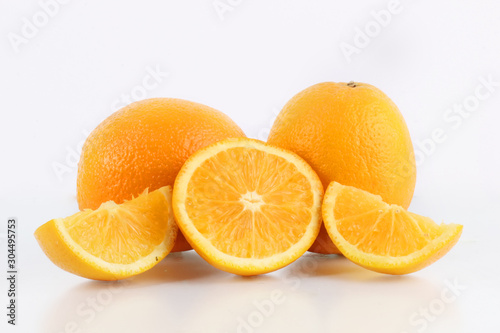 fresh orange fruit and ice with a white background