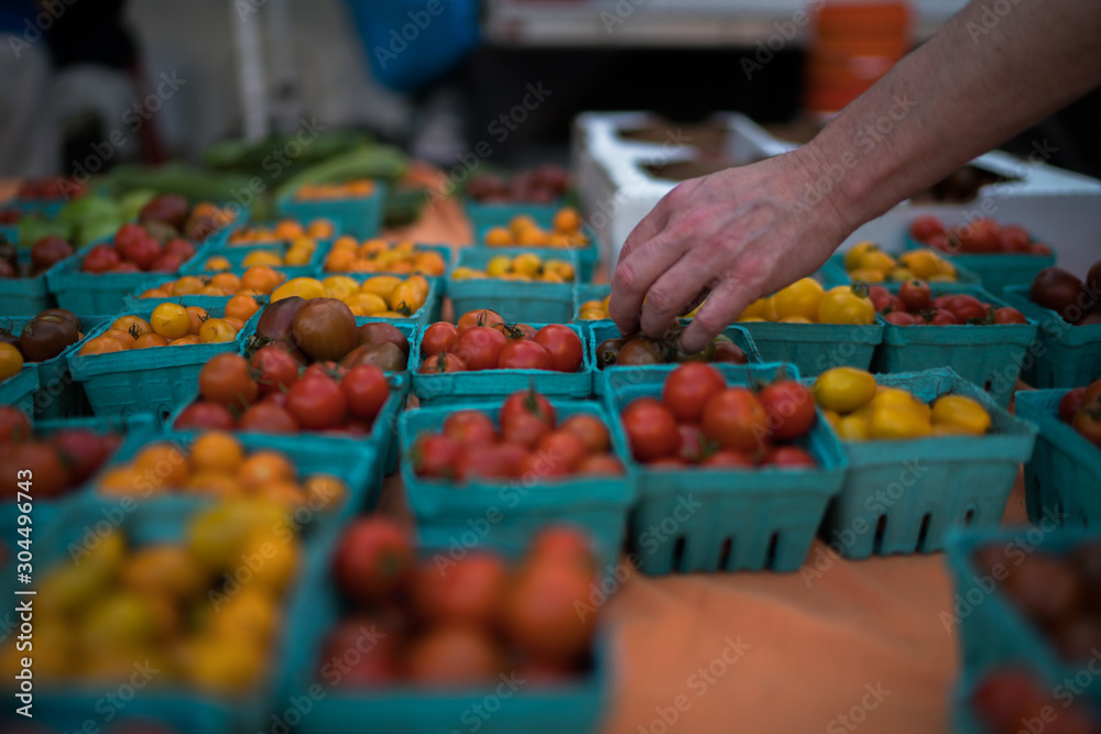 Fresh and organic vegetables at farmers market. People buying local vegetable from farm at market. Organic food. Farmers markets are a traditional way of selling agricultural products. Fresh and organic vegetables at farmers market. People buying local vegetable from farm at market. Organic food. Farmers markets are a traditional way of selling agricultural products.