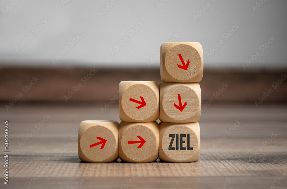 Cubes and dice with the german word for goal or target - Ziel on wooden background