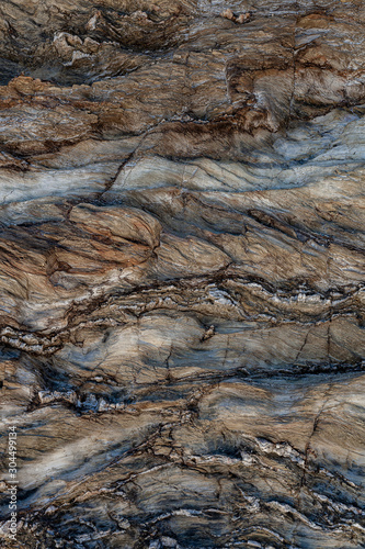 Textura natural da superfície da rocha, onde se pode ver as linhas desenhadas no longo do tempo. Pode ser usado como o fundo.