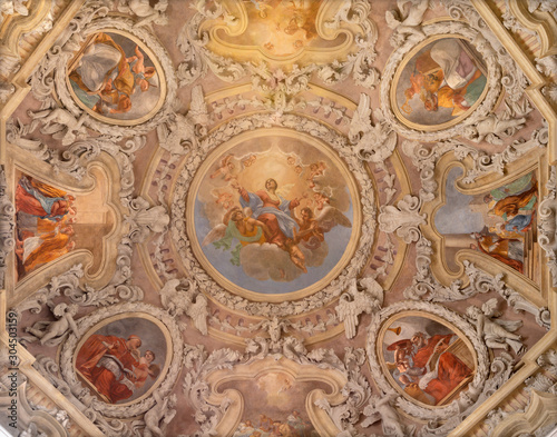RIVA DEL GARDA, ITALY - JUNE 13, 2019: The ceiling fresco of Assumption of Virgin Mary in the cupola of church Chiesa di Santa Maria Assunta (Cappella del Suffragio) by Teofilo Polacco (19 cent.).