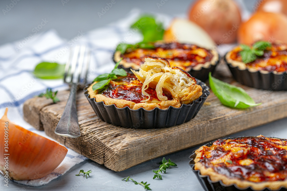 Delicious homemade mini pies with onions. Delicious homemade mini pies with onions.