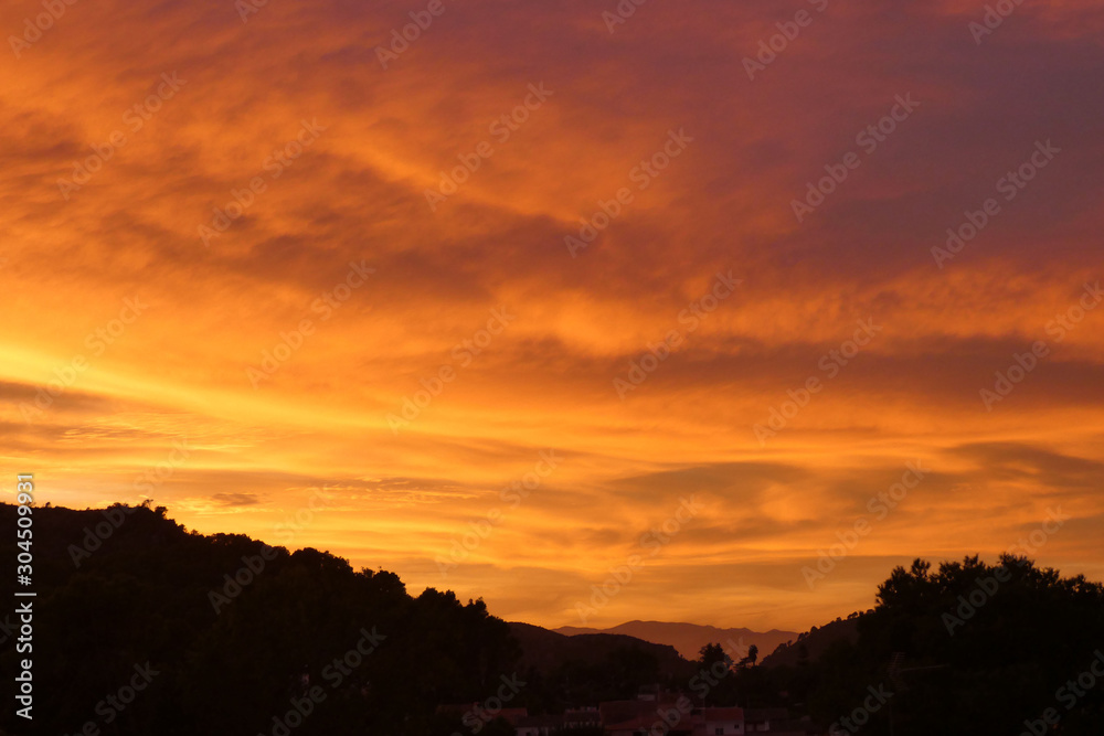 Bright Vibrant Orange And Yellow Colors Sunset Sky .