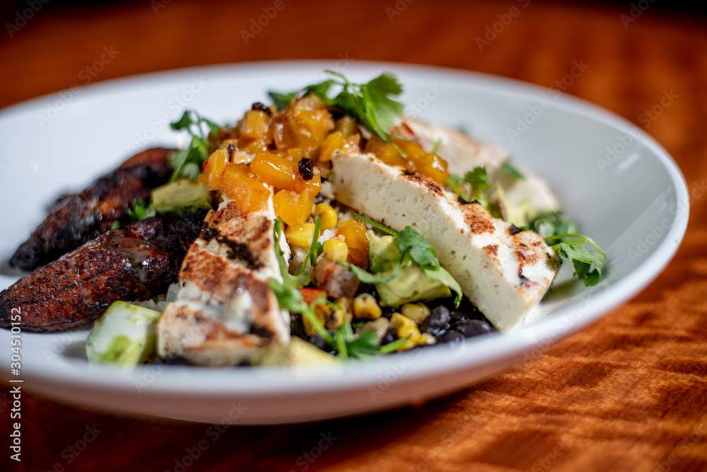 Tofu, Avocado and Mango Garnished Salad with Deep fried Ripe Plantains Tofu, Avocado and Mango Garnished Salad with Deep fried Ripe Plantains