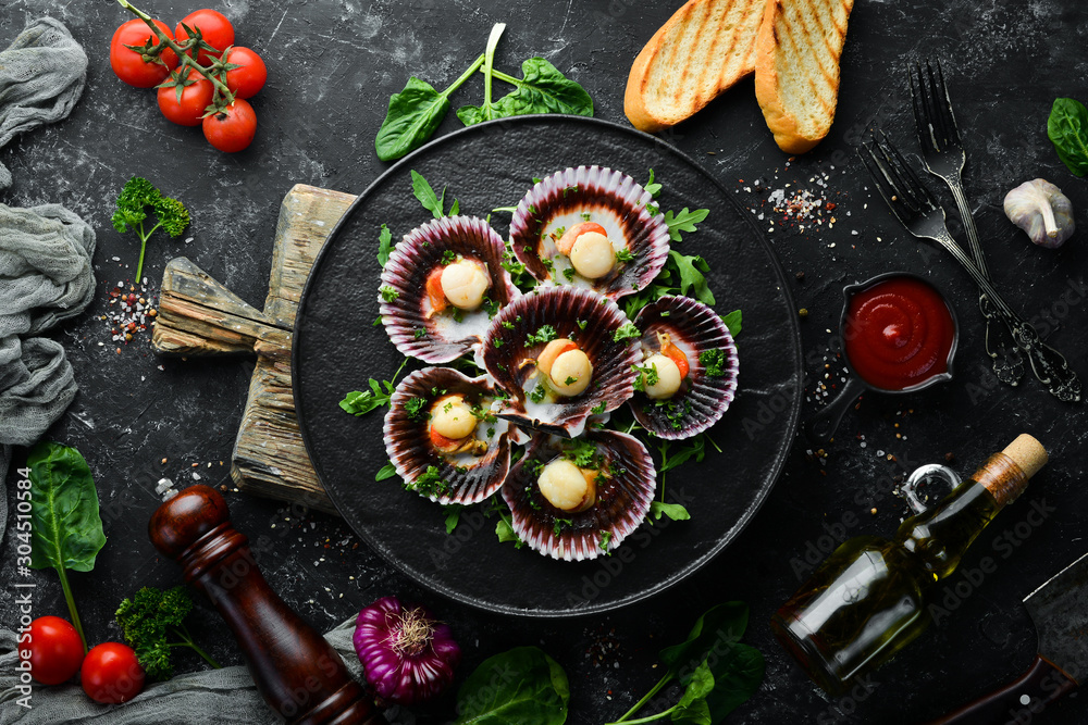 Baked scallops in shells with parsley and spices. Top view. Free space for your text. Baked scallops in shells with parsley and spices. Top view. Free space for your text.