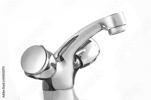 Clean chrome bath faucet against white background