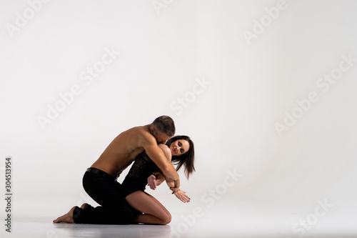 Fototapeta Naklejka Na Ścianę i Meble -  Duo Of two dancers Showing pose, Isolated On White