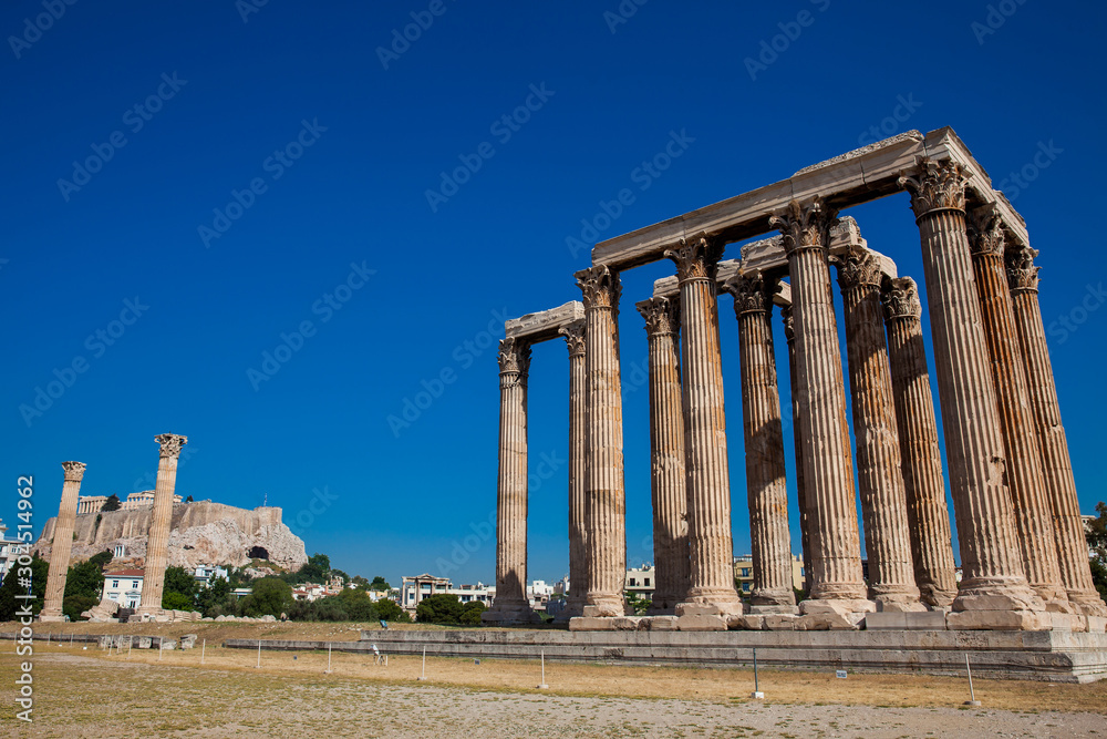 Ruins of the Temple of Olympian Zeus also known as the Olympieion and the Acropolis at the center of the Athens city in Greece