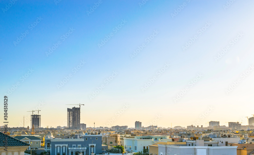 beautiful clean and growing city and skyscrapers of middle east with blue sky