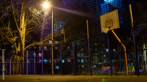 Photography Night basketball court illuminated by streetlights