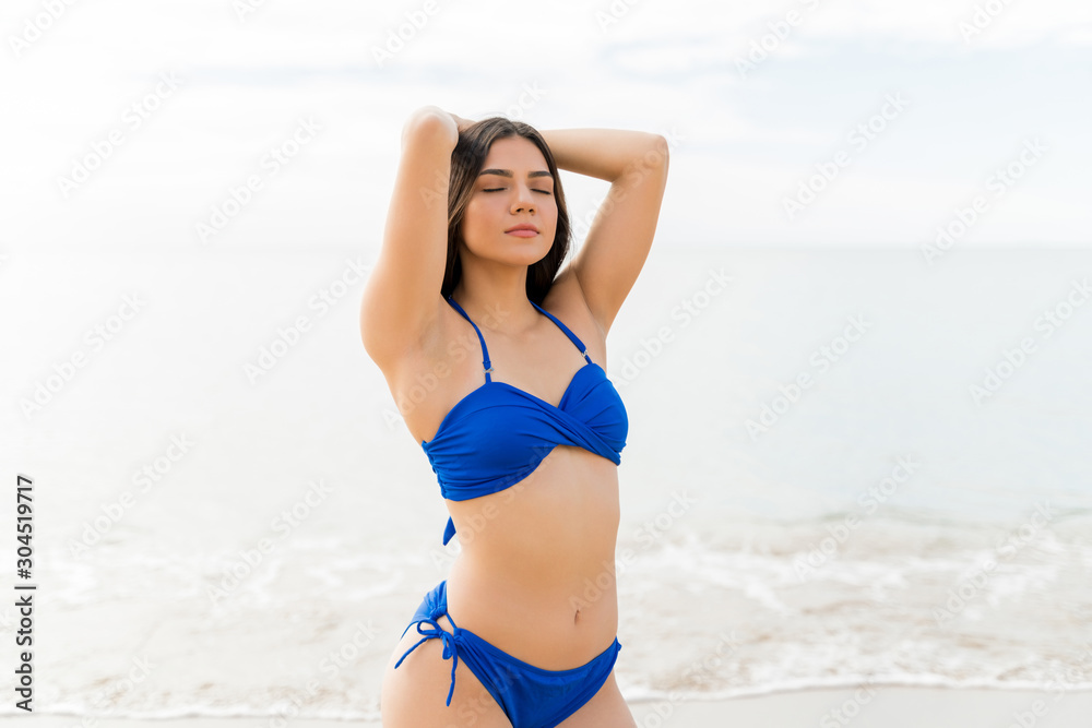 Woman Feeling Relaxed At Beach Woman Feeling Relaxed At Beach