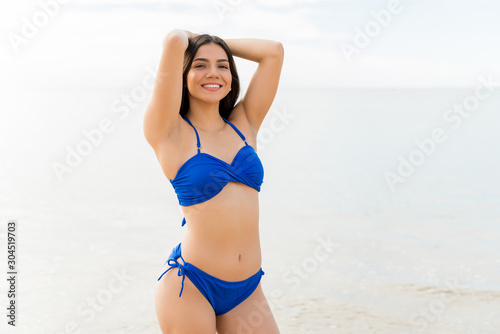 Young Woman In Swimsuit At Beach