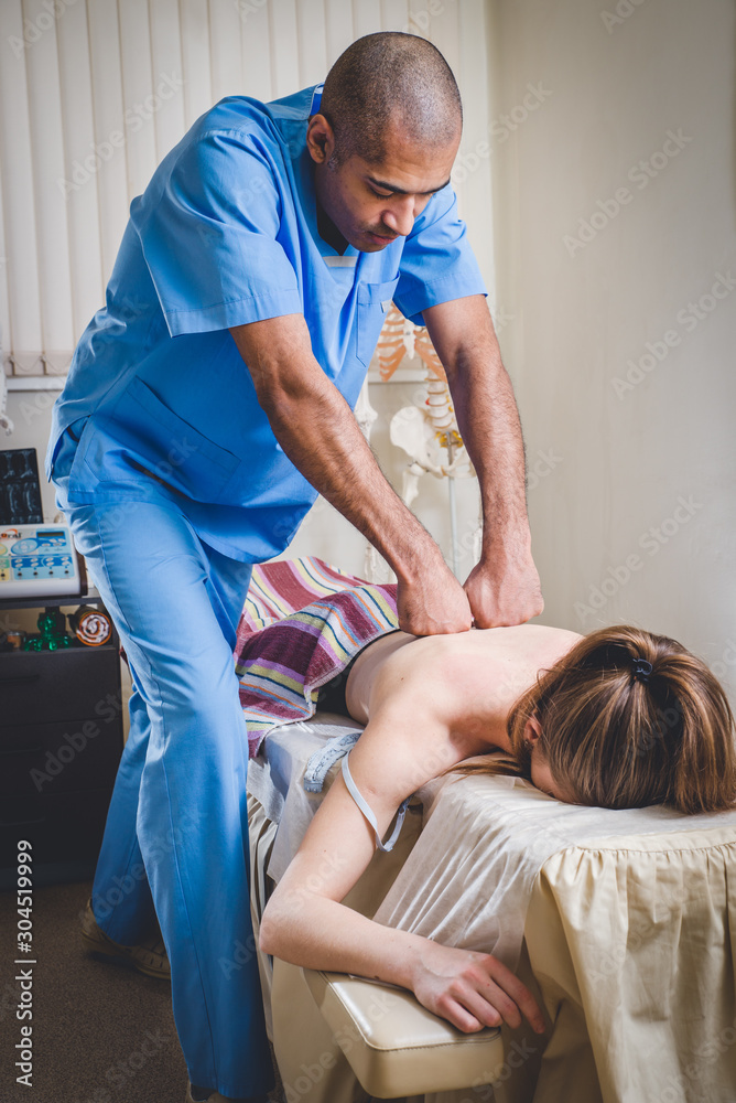 Fototapeta premium Close-up of physical therapist doing medical massage