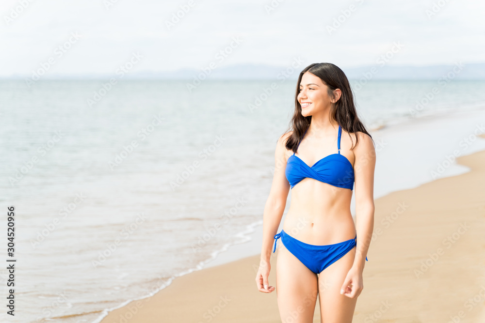 Woman In Bikini Smiling During Beach Holiday Woman In Bikini Smiling During Beach Holiday