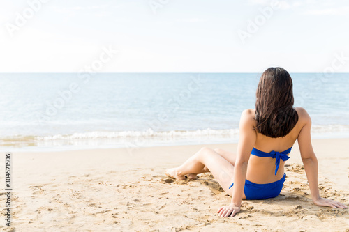 Woman Enjoying Summer Holiday At Beach