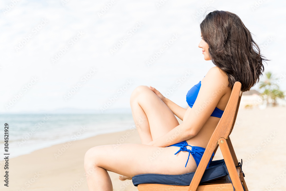 Woman Spending Leisure Time At Beach Woman Spending Leisure Time At Beach
