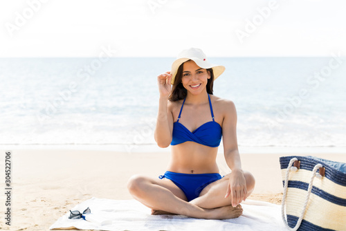 Beautiful Woman Resting On Beach Towel