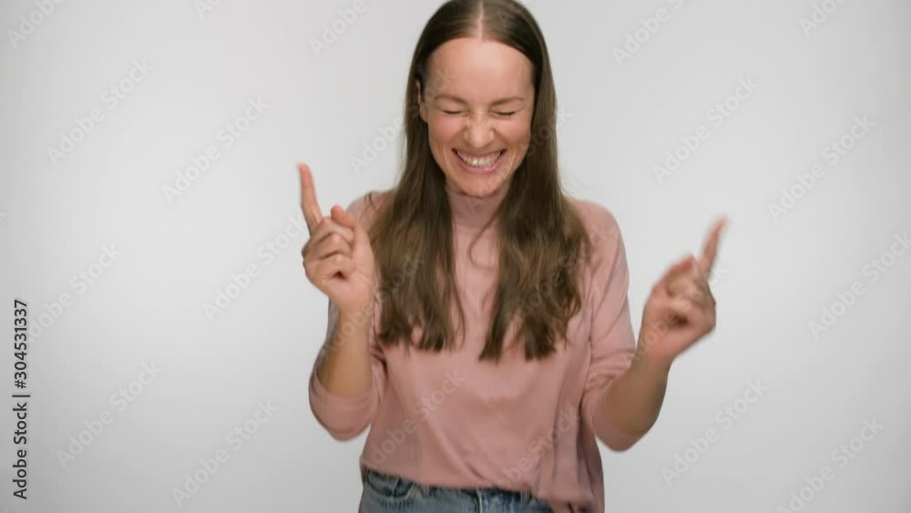 portrait of a woman who joyfully jumps and laughs