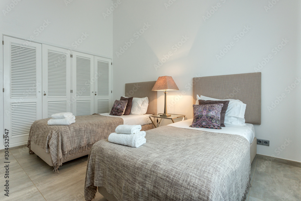 Modern bedroom with modern decor and furnishings.