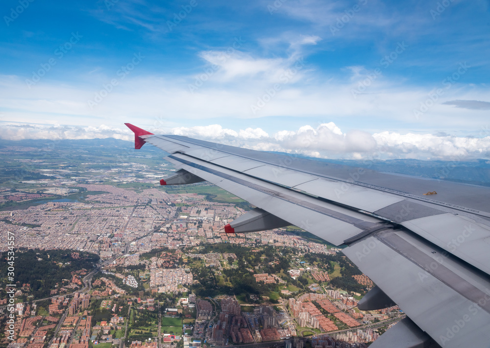 Aerial view of Bogota from the window of a plane on a sunny day. Colombia .