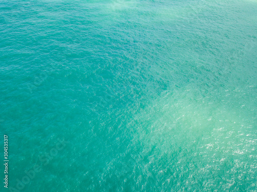 Aerial view of turquoise waves, water surface texture. Thailand © alexkazachok