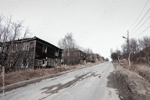 Old destroyed abandoned dirty raw wooden house with the broken © Lianna Art