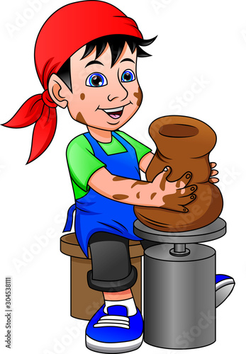 Happy little boy creating a vase on a pottery wheel