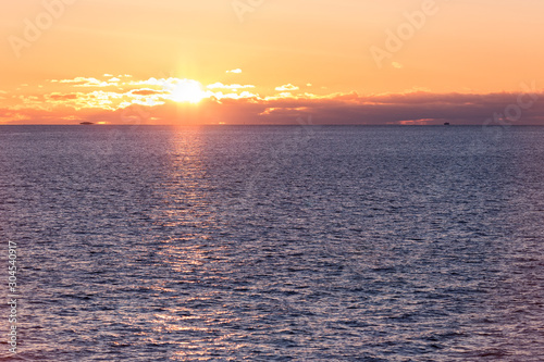 Sunset over the sea during the ferry trip to Lofoten islands (Norway) in winter