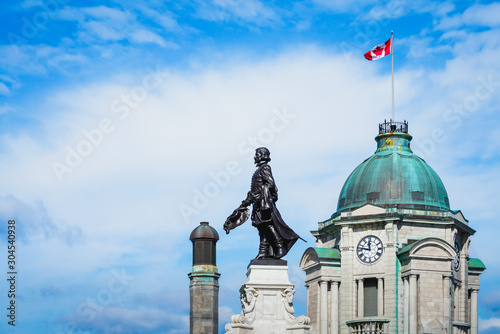 Monument of Samuel de Champlain Statue with Old Oost Office Tower in The Back