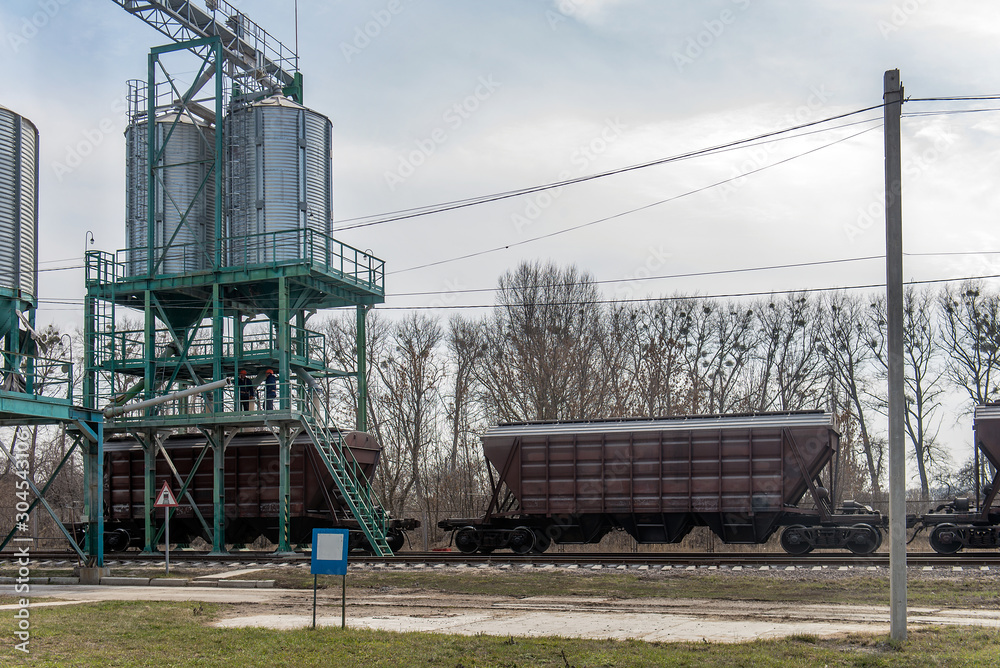loading grain into the wagons at the elevator loading grain into the wagons at the elevator