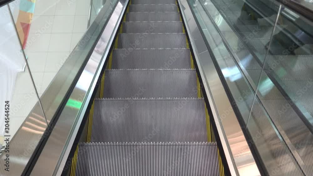 Moving escalator up in a public area. Moving escalator up in a public area.