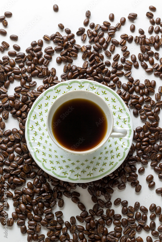 Colombian coffee beans coffee cup on white background Colombian coffee beans coffee cup on white background
