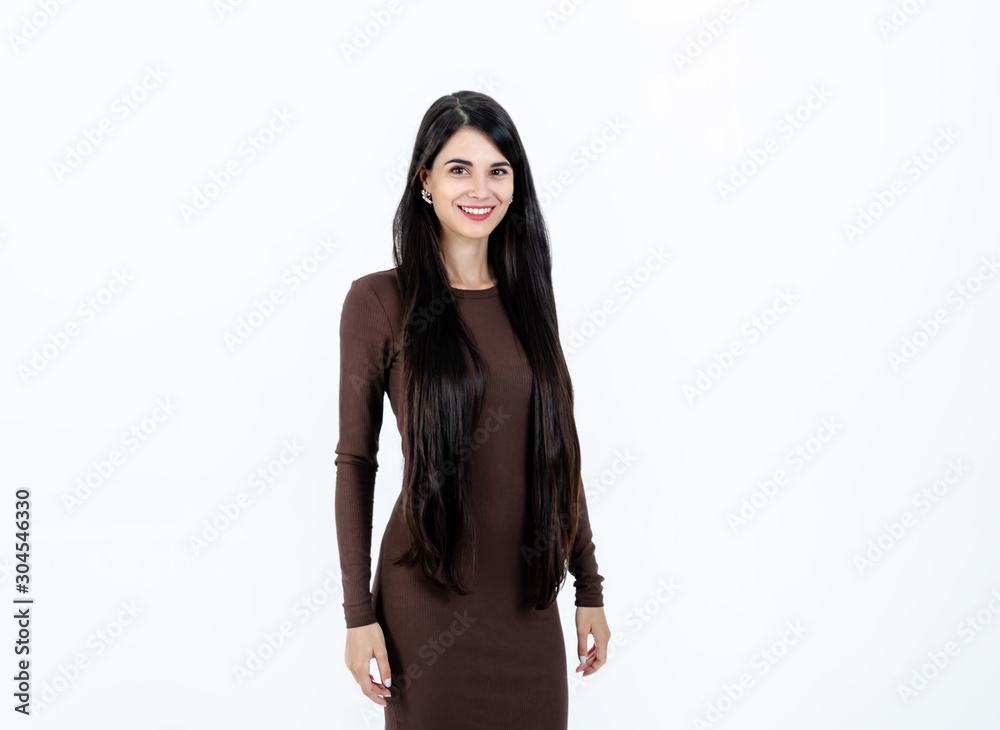 girl with long dark hair in a dress on a light background