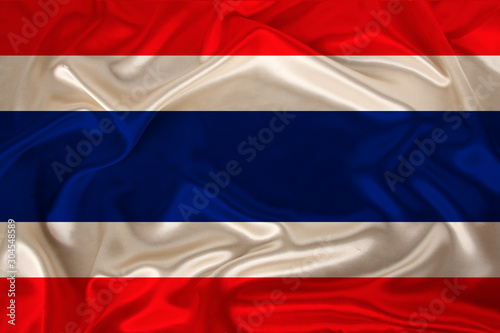 photo of Thailand national flag on a luxurious texture of satin, silk with waves, folds and highlights, closeup, copy space, travel concept, economy and state policy, illustration