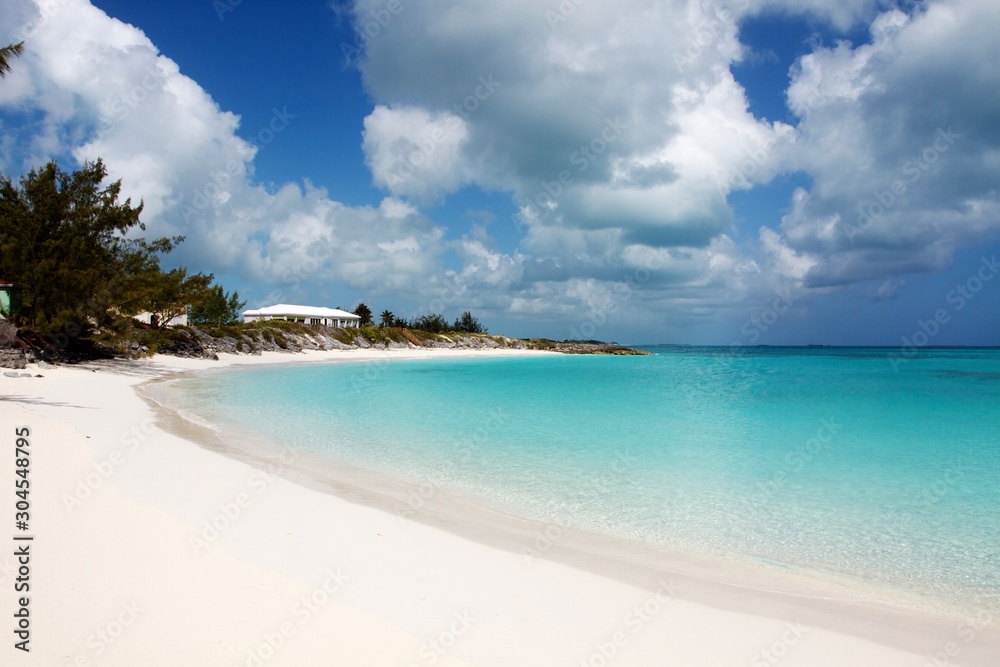 Tropical Caribbean white sand beach and clear turquoise sea water, Exuma, Bahamas 