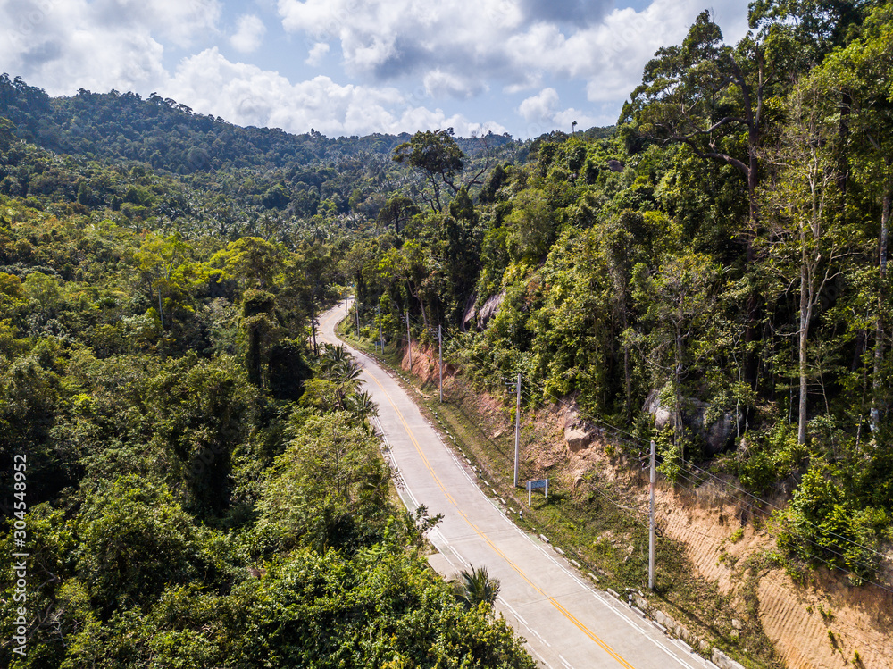 road running between the hills of Koh Phangan island. Thailand