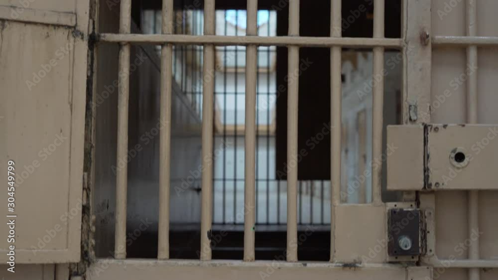 View of the corridor with prison cells. camera moves from bottom to top