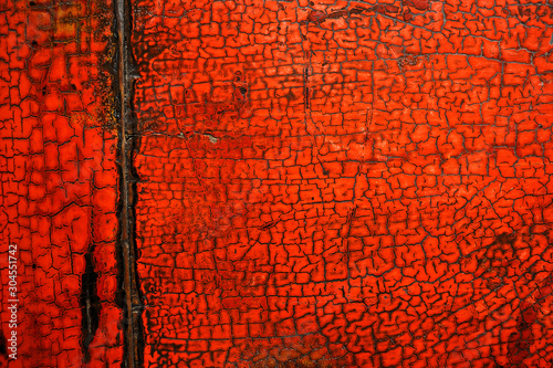 Close-up view at old wooden, red lacquer painted chinese table photo