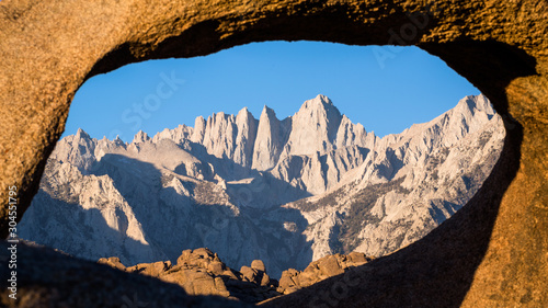 Mount Whitney summit through sandstone archway.