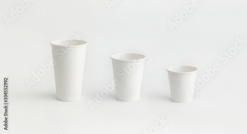 Photography three paper cups in line small medium large