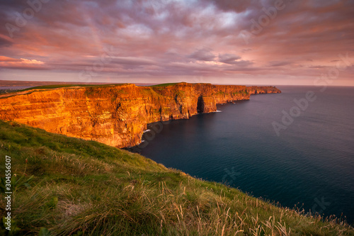 Obraz na plátně Cliffs of Moher Ireland at sunset in Ireland
