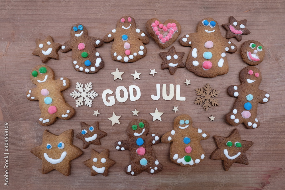 God Jul, Merry Christmas message with wooden letters and homemade gingerbread cookies