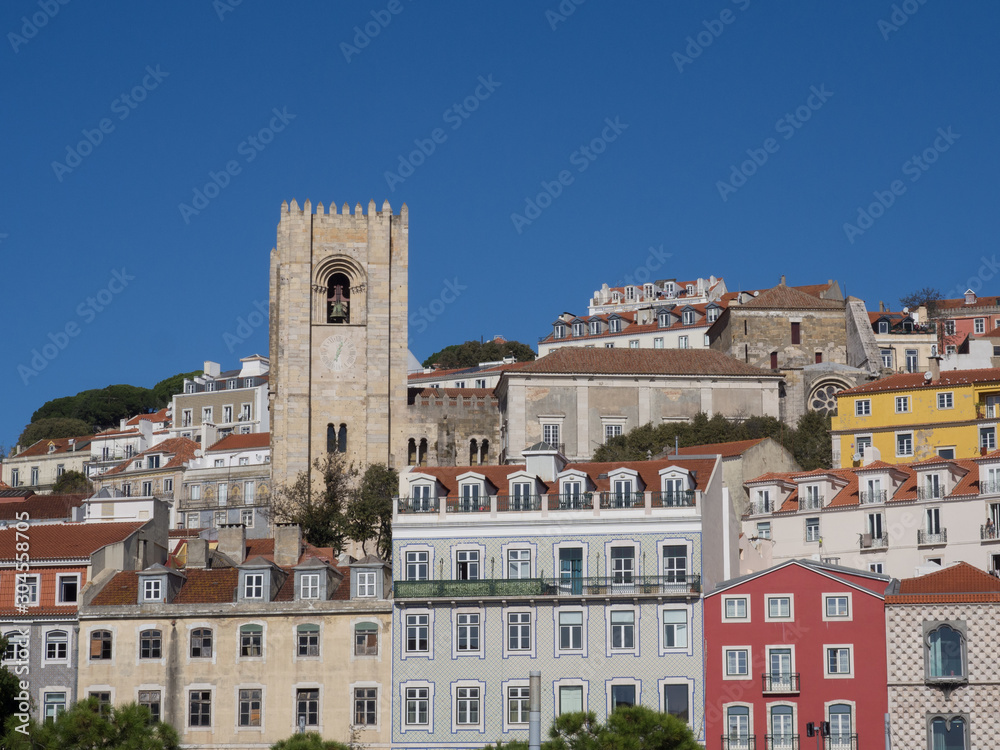 Bell tower of a church with multicolored facades in Lisbon