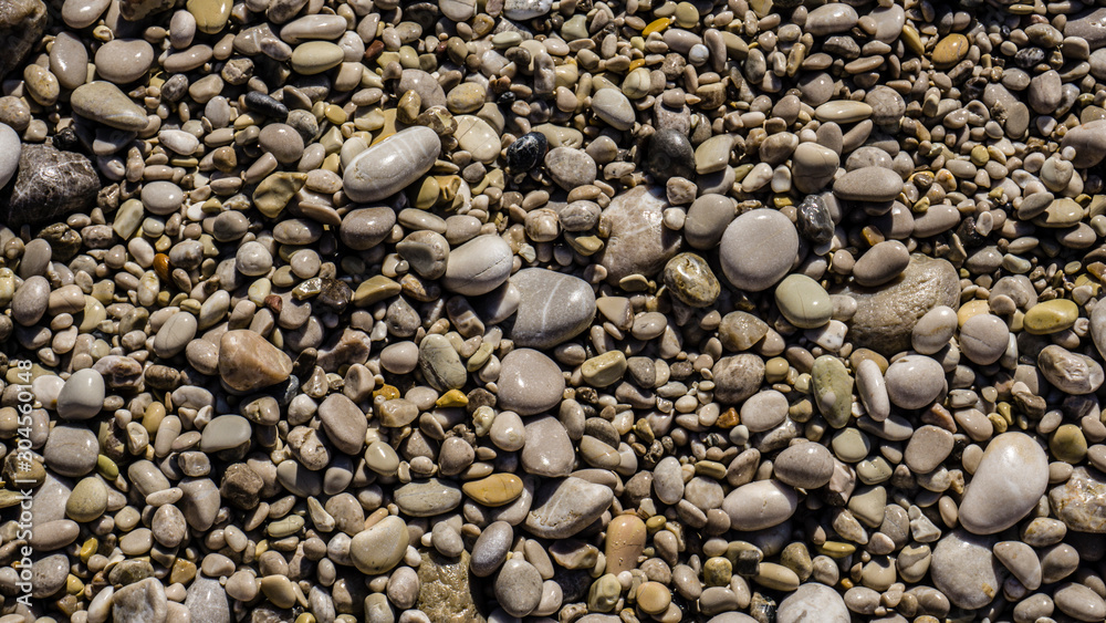 Pebble stones on the beach. Summer time concept. Pebble stones on the beach. Summer time concept.