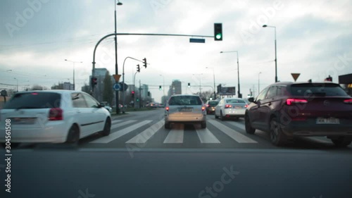 View from the windshield of a car on a highway with cars and taxis in Warsaw. Poland. 24. October. 2019. Car traffic in the city of Warsaw in the evening.