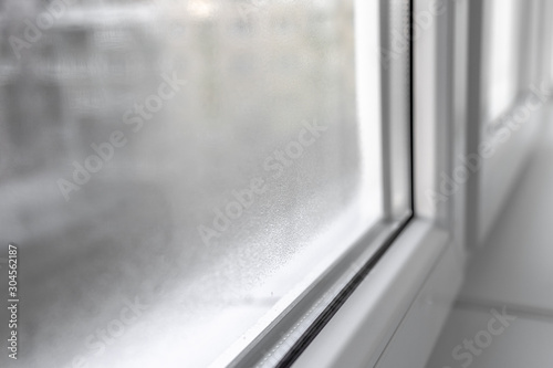 Water condensation on PVC windows during autumn. Plastic window.