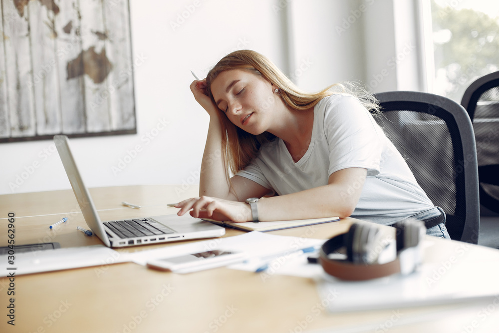 Students sleeping at the table. Girl learning and use the laptop Students sleeping at the table. Girl learning and use the laptop