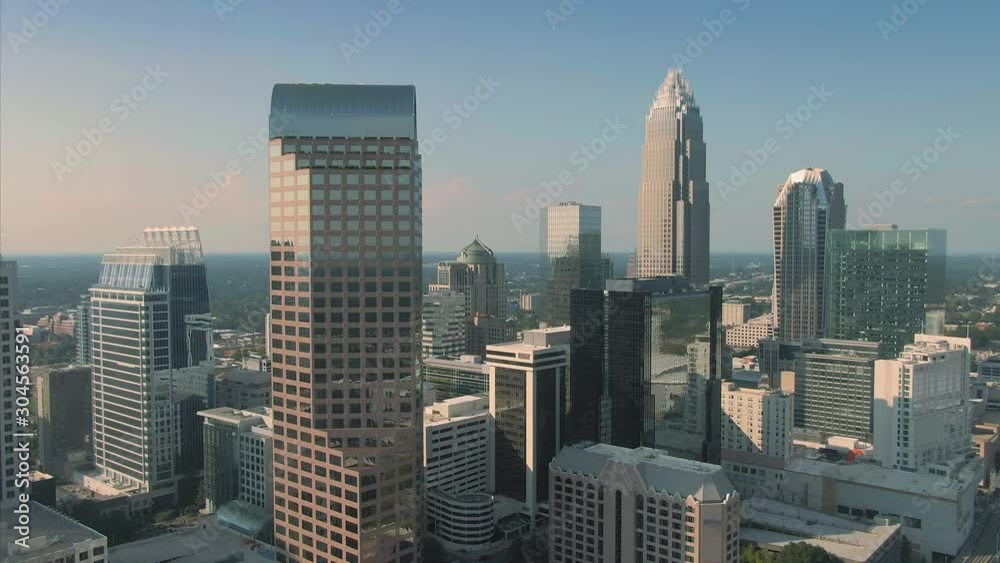 Aerial: downtown Charlotte buildings at sunset. Charlotte, North Carolina, USA. 10 August 2019 Aerial: downtown Charlotte buildings at sunset. Charlotte, North Carolina, USA. 10 August 2019